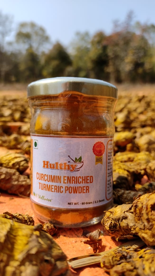 Bagdara Haldi" logo in bold letters with a golden yellow background, surrounded by green leaves and turmeric roots. The logo is centrally positioned on the image, conveying a premium and organic feel. The brand's name and logo signify its commitment to providing the best turmeric products globally.