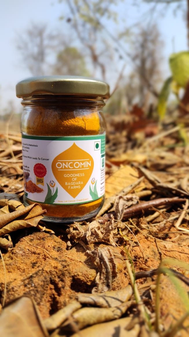 A close-up image of Oncomin capsules in a bottle with the Bagdara Farms logo, a turmeric-based dietary supplement for cancer prevention and treatment.