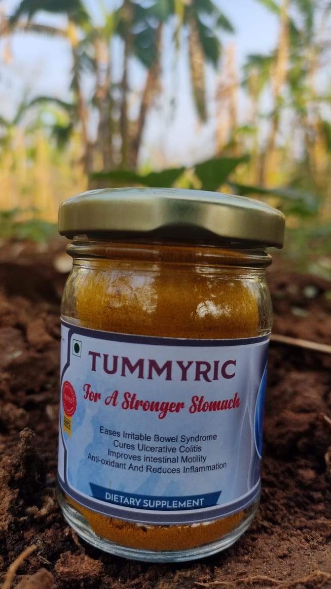 An image of a bottle of Tummyric, a turmeric-based dietary supplement by Bagdara Farms, showcasing its golden color and natural goodness for promoting gut health